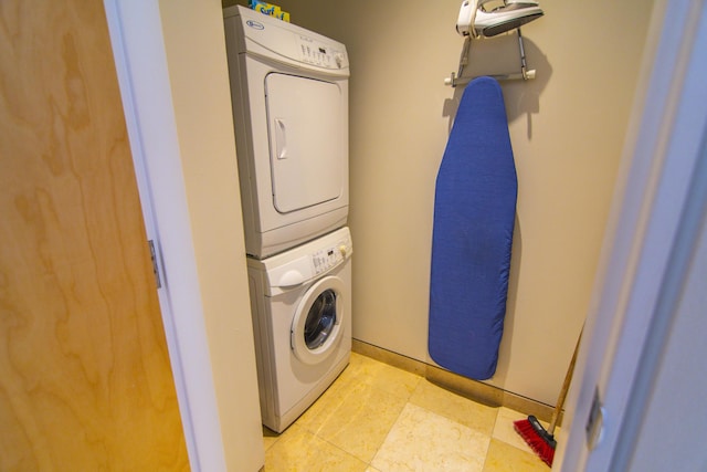 laundry room with stacked washer and clothes dryer