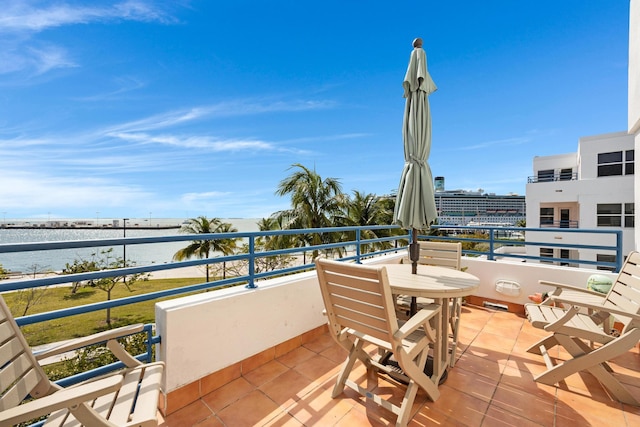 balcony featuring a water view