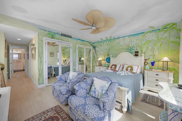 bedroom with french doors, ceiling fan, wood finished floors, and wallpapered walls