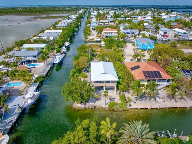 aerial view featuring a water view and a residential view