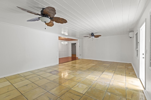 tiled spare room featuring ceiling fan with notable chandelier