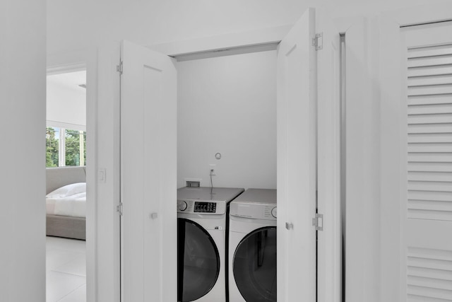 clothes washing area featuring washing machine and clothes dryer