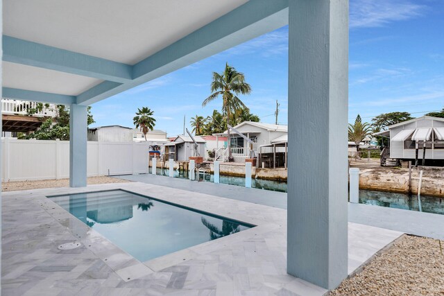 view of patio / terrace with an outdoor wet bar and ceiling fan