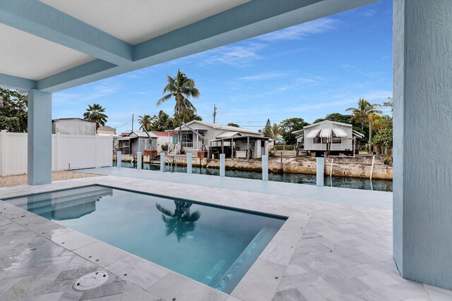 view of patio / terrace with ceiling fan and an outdoor wet bar