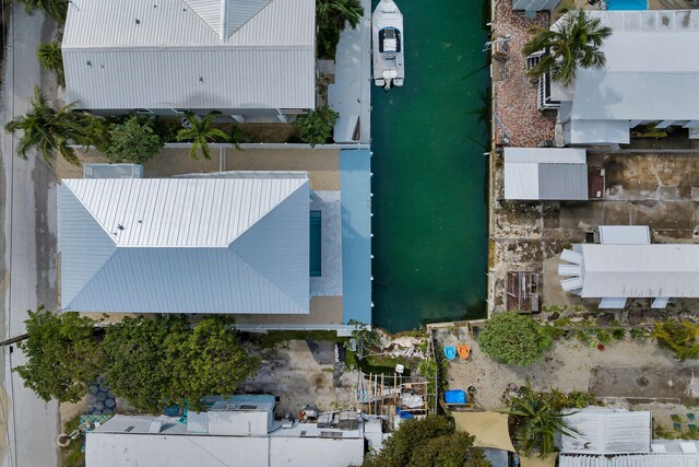 view of swimming pool featuring a water view and a patio