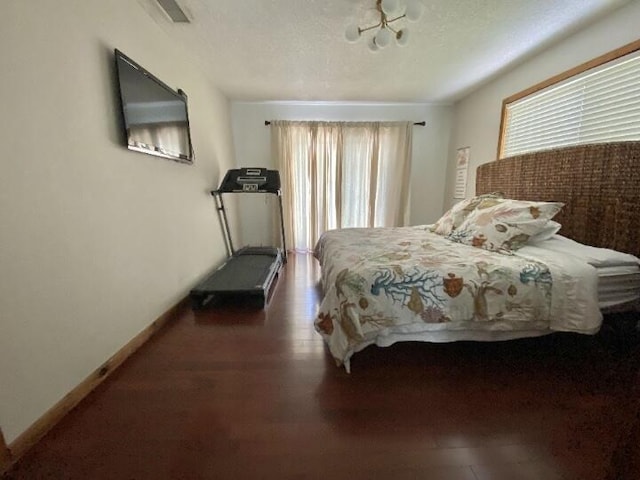 880 La Paloma Rd, Key Largo, FL 33037 - bedroom featuring multiple windows, baseboards, and dark wood-type flooring