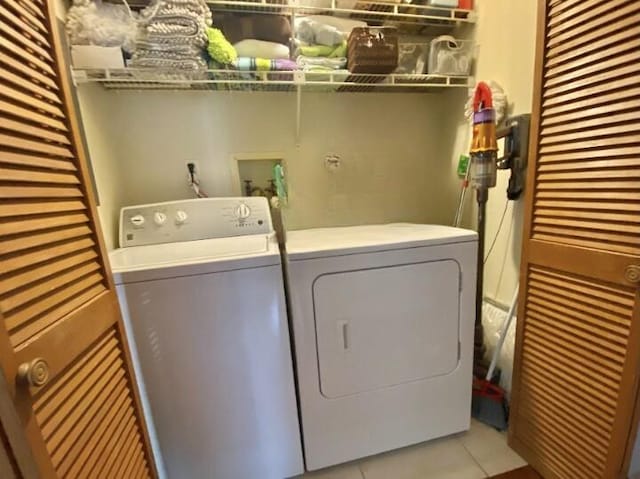 880 La Paloma Rd, Key Largo, FL 33037 - washroom with separate washer and dryer and light tile patterned flooring
