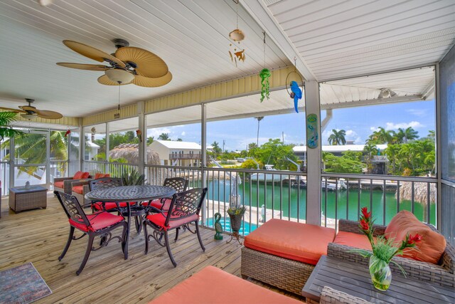 17166 W Wahoo Ln, Sugarloaf, FL 33042 - sunroom / solarium featuring a water view, ceiling fan, and outdoor dining area