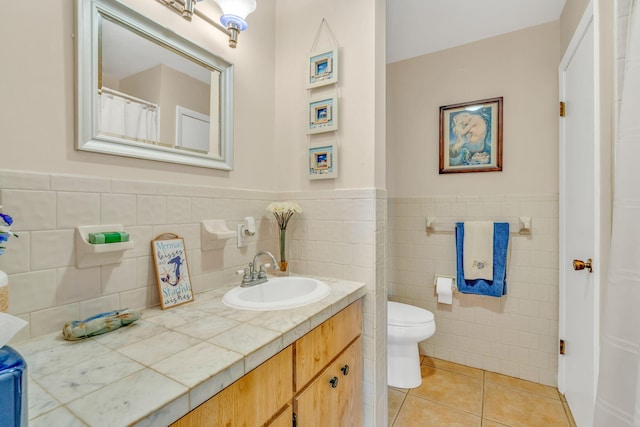 17166 W Wahoo Ln, Sugarloaf, FL 33042 - bathroom with vanity, tile walls, tile patterned flooring, and wainscoting