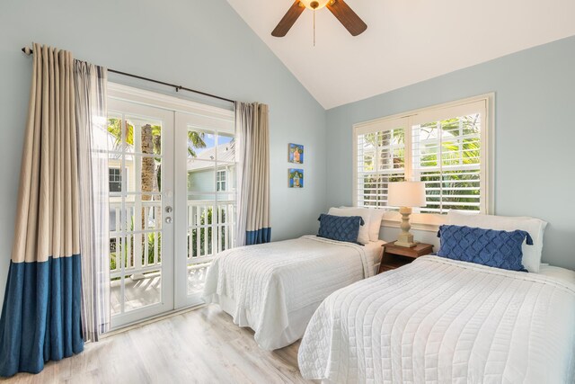 532 Porter Ln, Key West, FL 33040 - bedroom with access to exterior, multiple windows, wood finished floors, french doors, and high vaulted ceiling