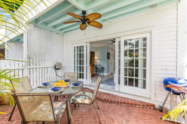 532 Porter Ln, Key West, FL 33040 - wooden deck with a ceiling fan, a patio area, and outdoor dining space