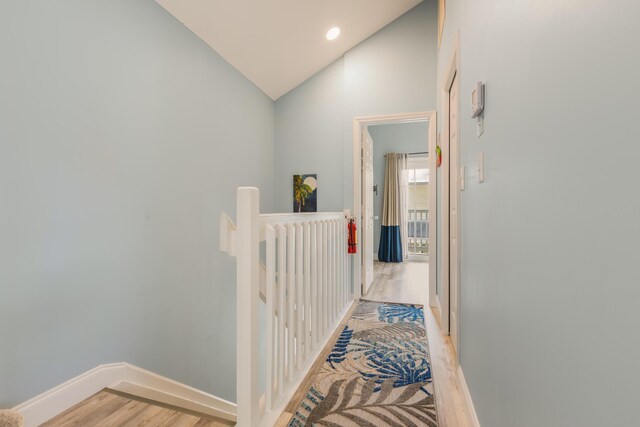 532 Porter Ln, Key West, FL 33040 - hallway featuring lofted ceiling, an upstairs landing, light wood-style floors, baseboards, and recessed lighting