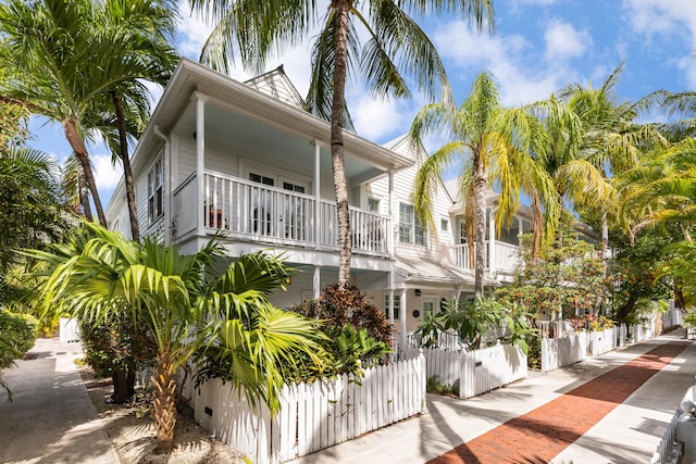 532 Porter Ln, Key West, FL 33040 - view of property exterior featuring a balcony and a gate