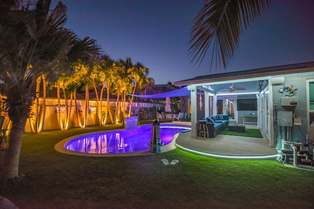 3034 Riviera Dr, Key West, FL 33040 - pool at twilight featuring outdoor lounge area, a yard, a ceiling fan, fence, and a fenced in pool