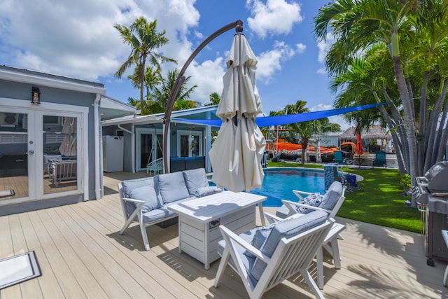 3034 Riviera Dr, Key West, FL 33040 - wooden deck featuring an outdoor living space, an outdoor pool, and french doors