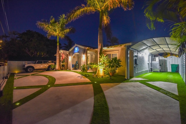 3034 Riviera Dr, Key West, FL 33040 - view of front of home featuring fence, a gate, and stucco siding