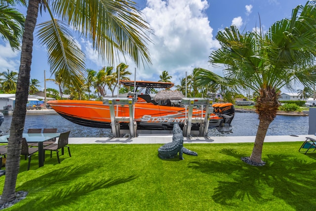 3034 Riviera Dr, Key West, FL 33040 - exterior space featuring a water view, a boat dock, a lawn, and boat lift