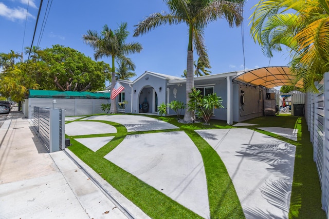 3034 Riviera Dr, Key West, FL 33040 - view of front of house featuring fence and stucco siding