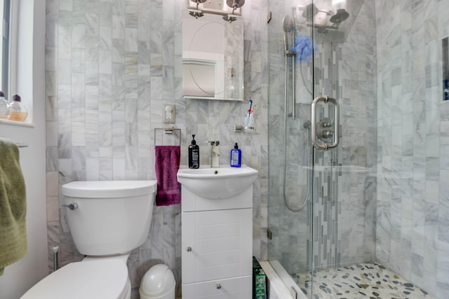 3034 Riviera Dr, Key West, FL 33040 - bathroom featuring tile walls, toilet, a shower stall, vanity, and backsplash