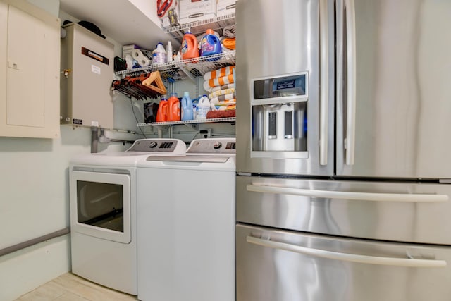 3034 Riviera Dr, Key West, FL 33040 - clothes washing area with electric panel, washing machine and dryer, and laundry area