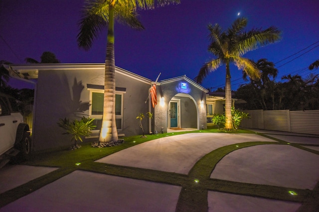 3034 Riviera Dr, Key West, FL 33040 - view of front of home featuring stucco siding and fence