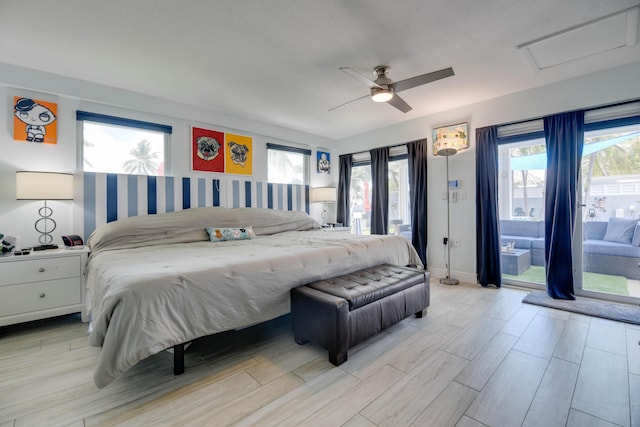 3034 Riviera Dr, Key West, FL 33040 - bedroom featuring access to outside, wood finished floors, attic access, and multiple windows