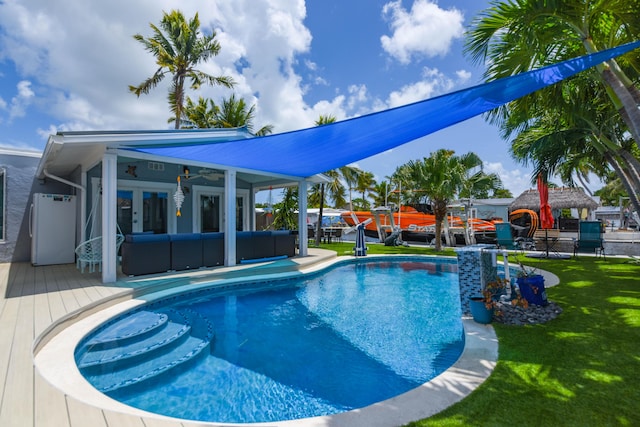 3034 Riviera Dr, Key West, FL 33040 - pool featuring french doors, an outdoor hangout area, a wooden deck, and a lawn