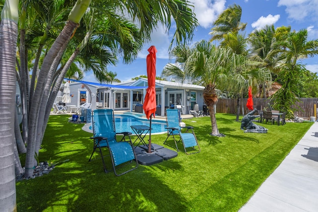 3034 Riviera Dr, Key West, FL 33040 - exterior space with french doors, fence, and a yard