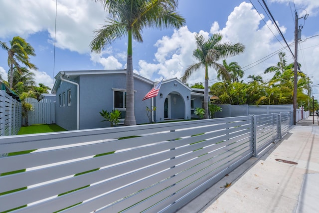 3034 Riviera Dr, Key West, FL 33040 - view of front of house with stucco siding and a fenced front yard