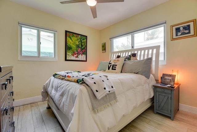 3034 Riviera Dr, Key West, FL 33040 - bedroom with light wood-type flooring, baseboards, and a ceiling fan