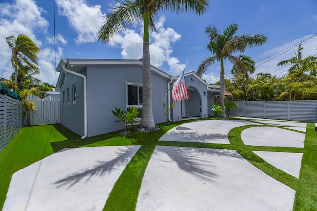 3034 Riviera Dr, Key West, FL 33040 - view of front of house with stucco siding and fence