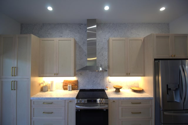 kitchen with wall chimney exhaust hood, stainless steel appliances, and backsplash