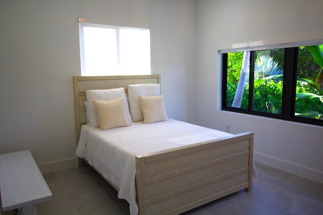 bedroom featuring multiple windows