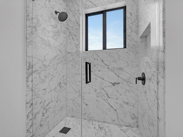 bathroom with a shower with shower door