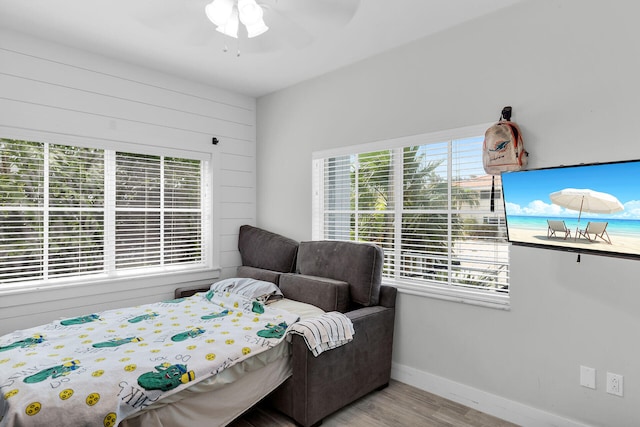 241 W Seaview Dr, Duck, FL 33050 - bedroom with wood finished floors, baseboards, and a ceiling fan