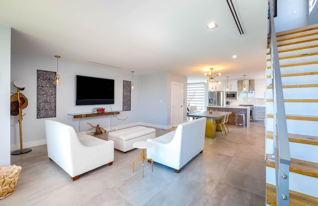 94825 Overseas Hwy Unit 204, Key Largo, FL 33037 - living area featuring stairs, a chandelier, recessed lighting, and baseboards
