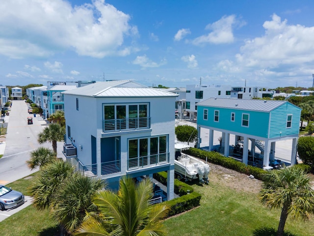 94825 Overseas Hwy Unit 204, Key Largo, FL 33037 - back of property with metal roof, stucco siding, and a residential view