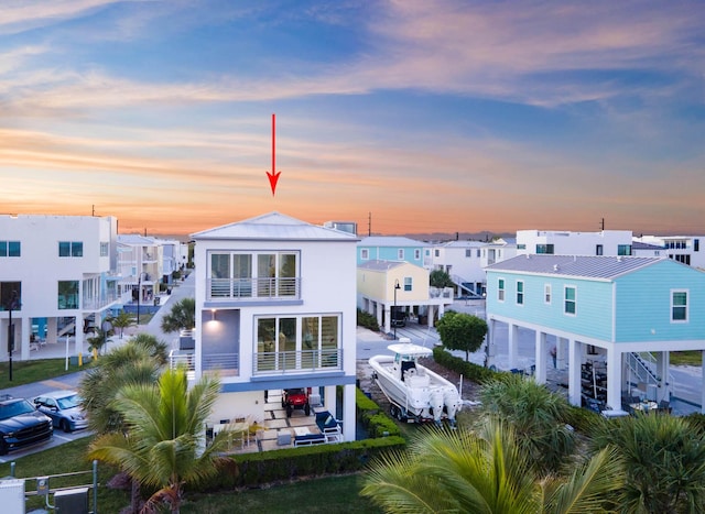 94825 Overseas Hwy Unit 204, Key Largo, FL 33037 - back of house at dusk featuring a residential view