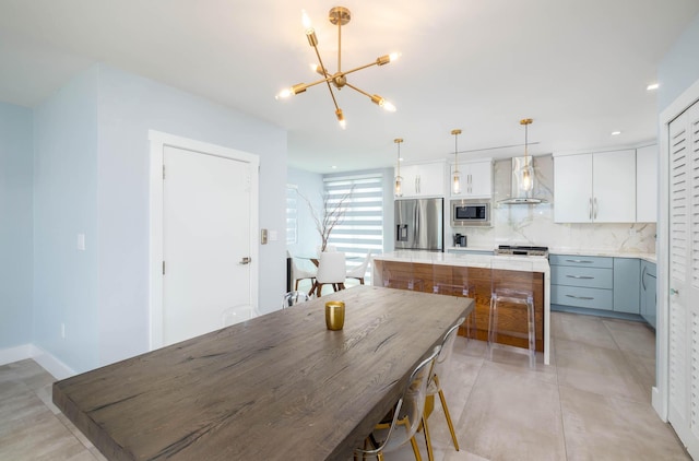 94825 Overseas Hwy Unit 204, Key Largo, FL 33037 - dining area with a chandelier, light tile patterned floors, and recessed lighting