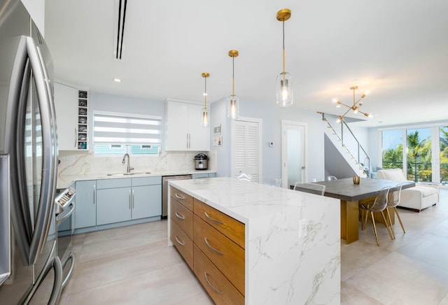 94825 Overseas Hwy Unit 204, Key Largo, FL 33037 - kitchen featuring appliances with stainless steel finishes, a sink, open floor plan, plenty of natural light, and recessed lighting