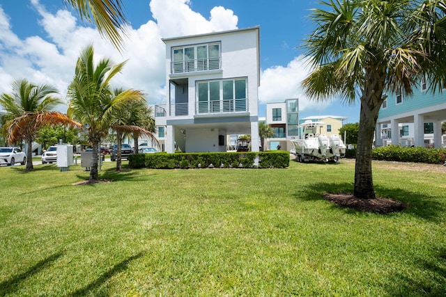 94825 Overseas Hwy Unit 204, Key Largo, FL 33037 - view of front of house featuring stucco siding and a front lawn