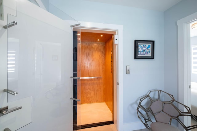 94825 Overseas Hwy Unit 204, Key Largo, FL 33037 - hallway featuring elevator and baseboards