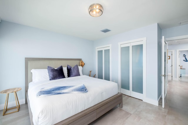 94825 Overseas Hwy Unit 204, Key Largo, FL 33037 - bedroom with two closets and baseboards