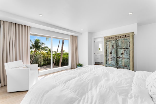 bedroom with light hardwood / wood-style floors