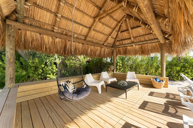 wooden deck with a gazebo and outdoor lounge area