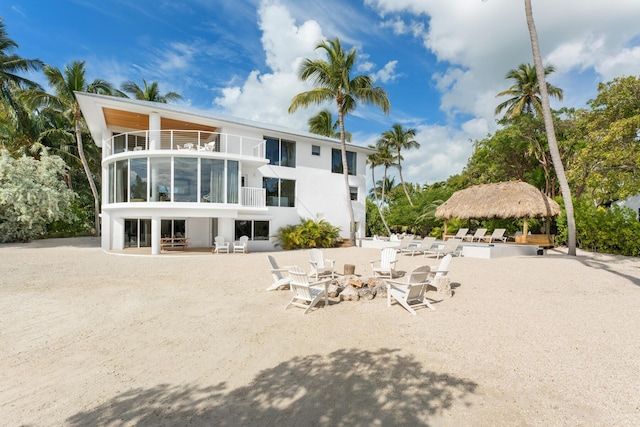 back of house with a patio and a balcony