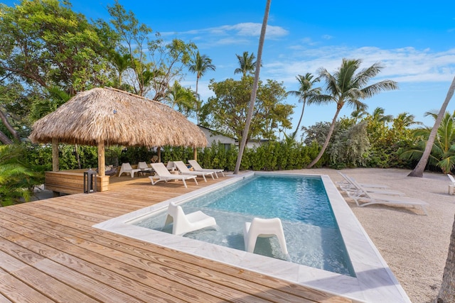 view of swimming pool featuring a gazebo and a wooden deck