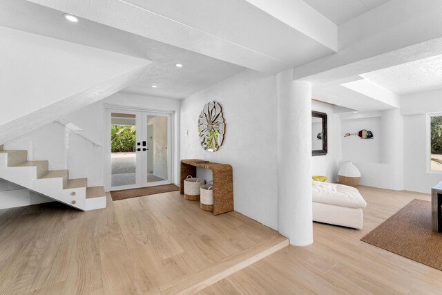 interior space featuring light hardwood / wood-style floors and french doors