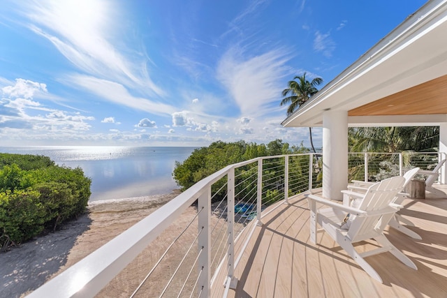 balcony featuring a water view