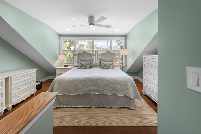 bedroom with dark wood-style flooring, a ceiling fan, and baseboards